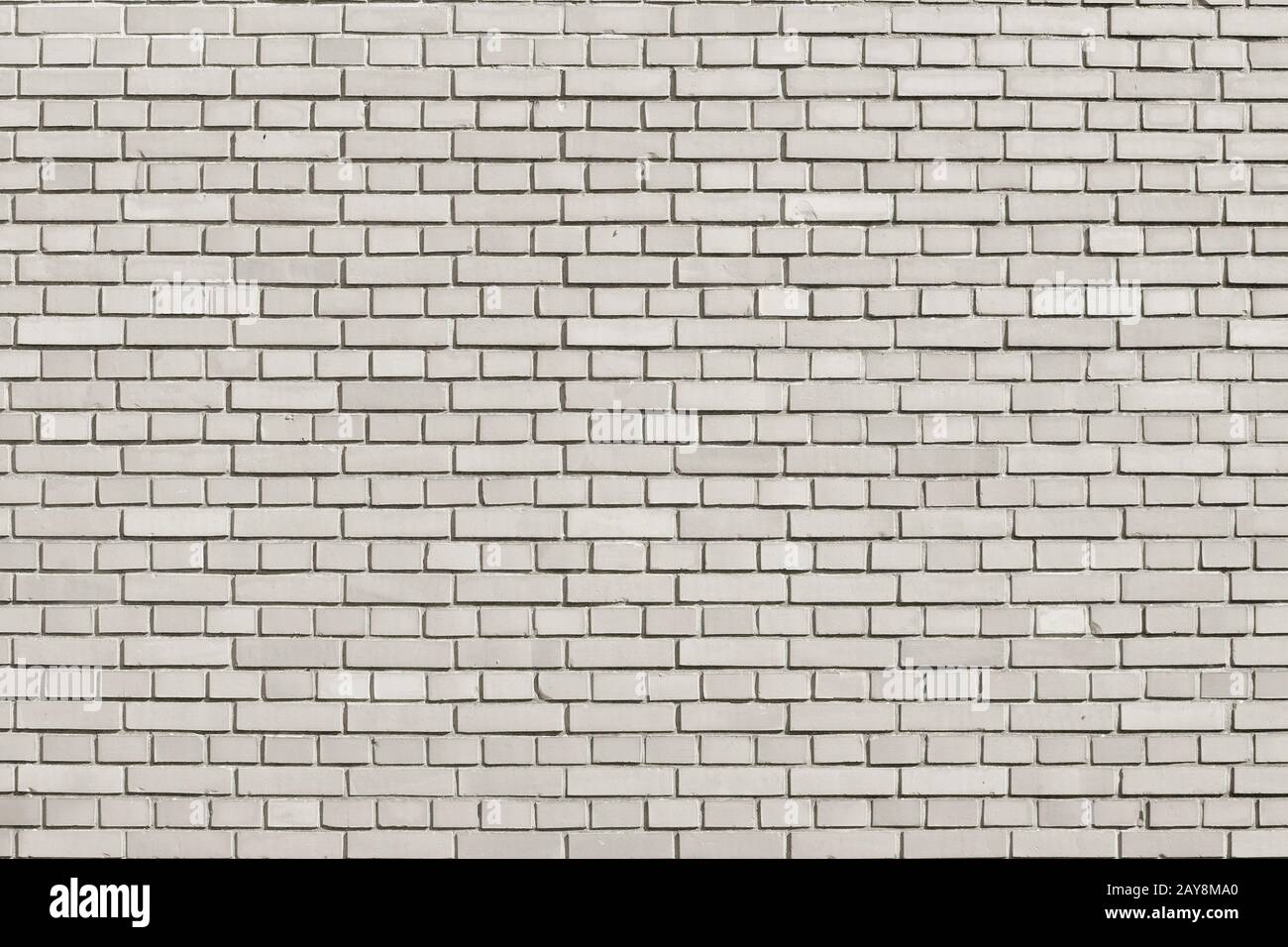 Tofu colored brick wall background Stock Photo
