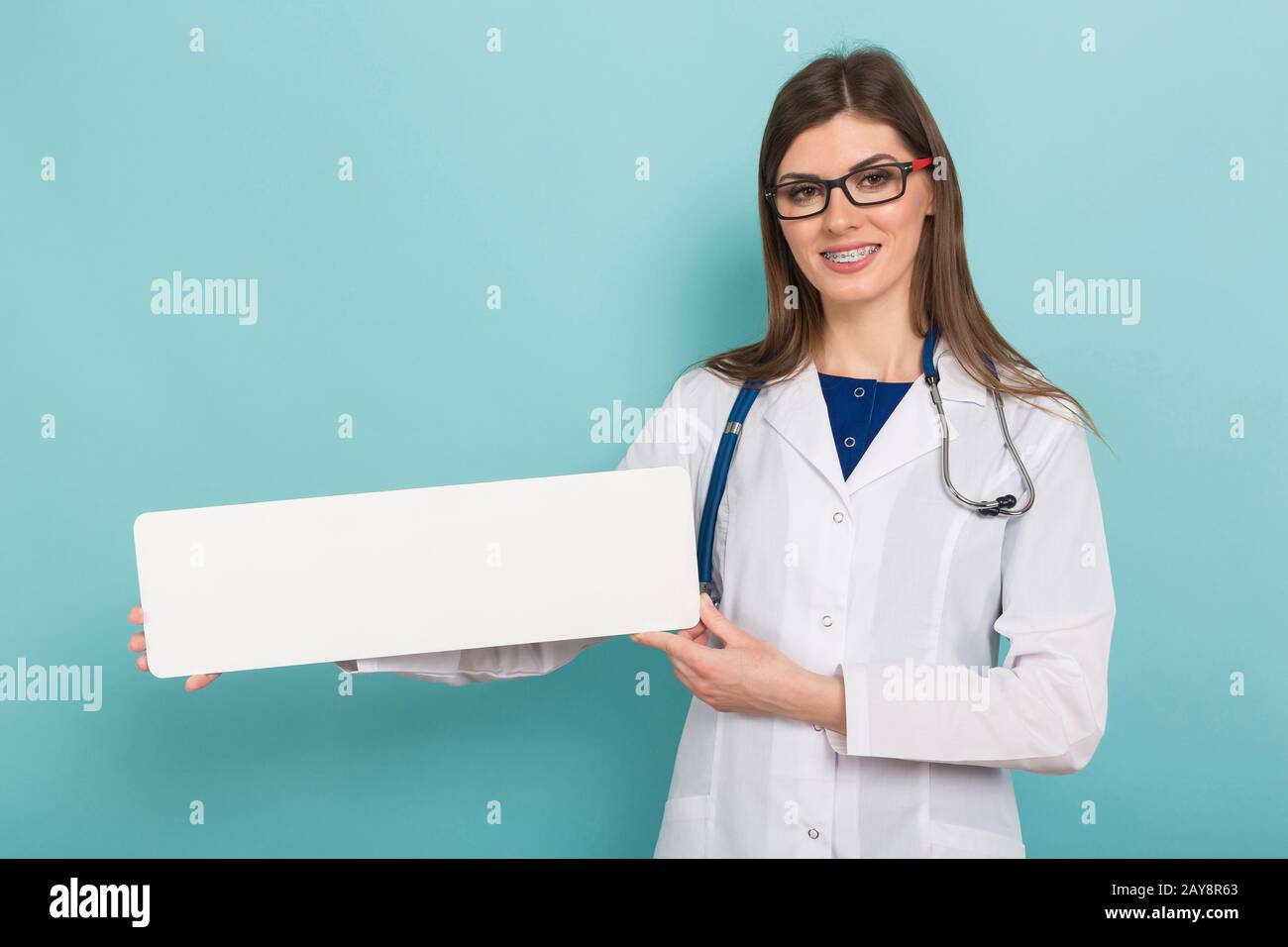 Female doctor with small banner Stock Photo - Alamy