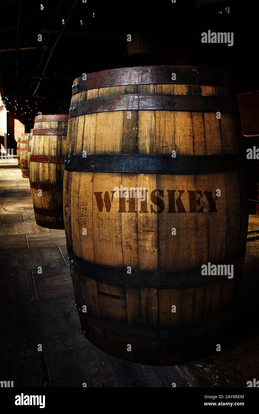 Whiskey aging in old wooden barrels Stock Photo