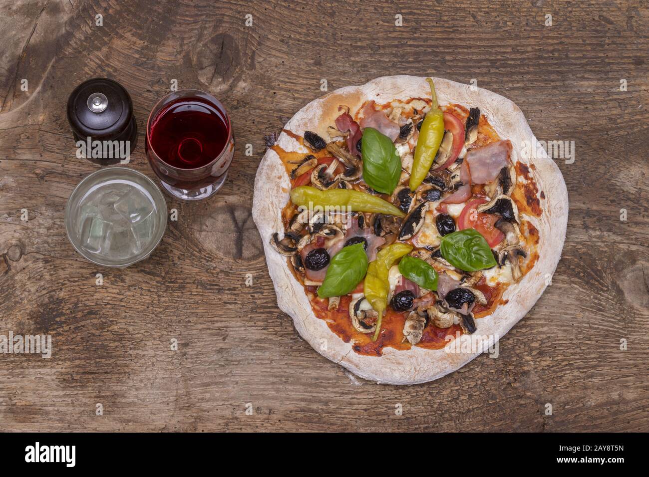 Supervision of a pizza on wood Stock Photo