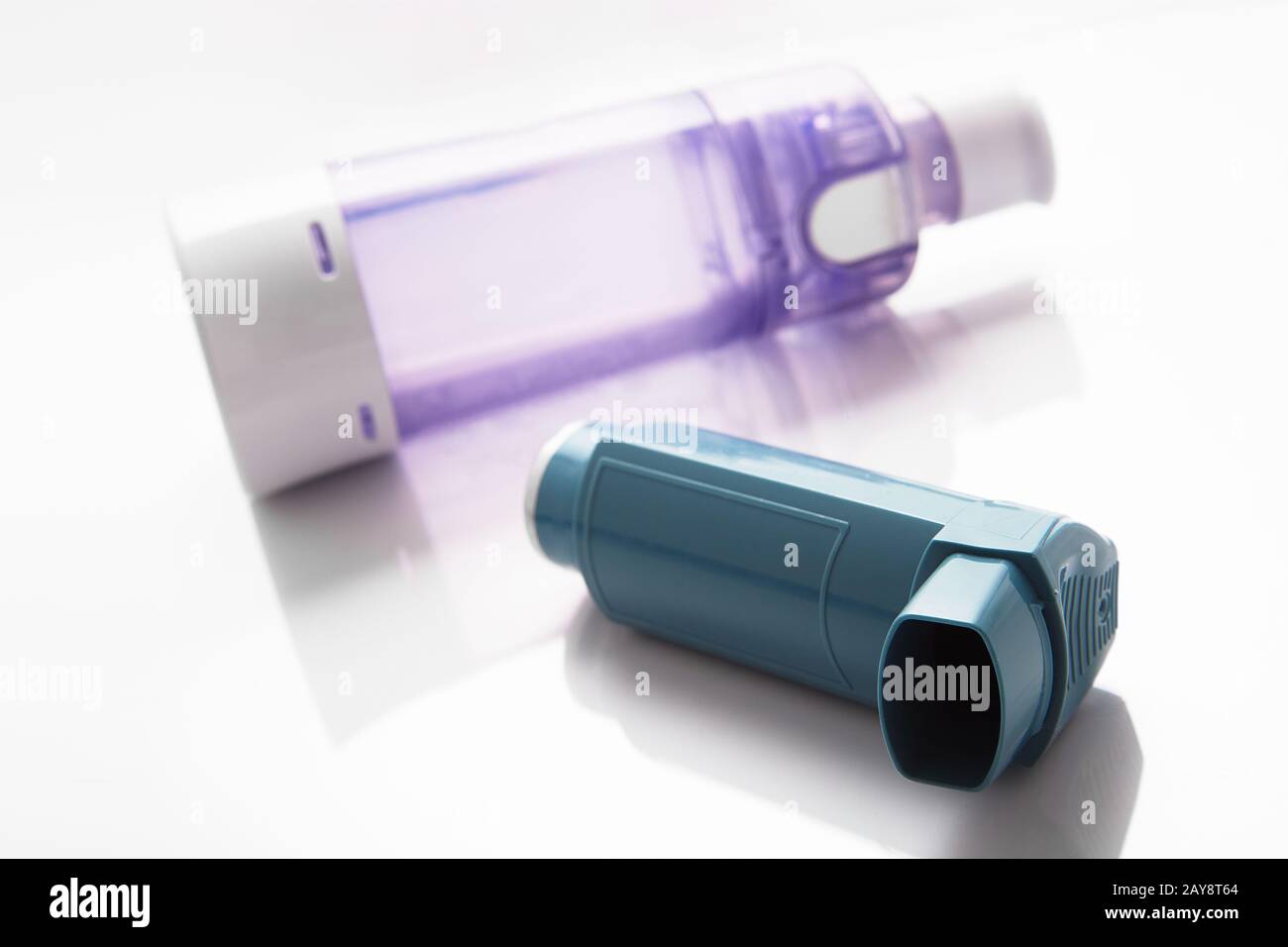MDI Inhaler with chamber spacer. Asthma and Allergy aerosol for people with respiratory problems Stock Photo