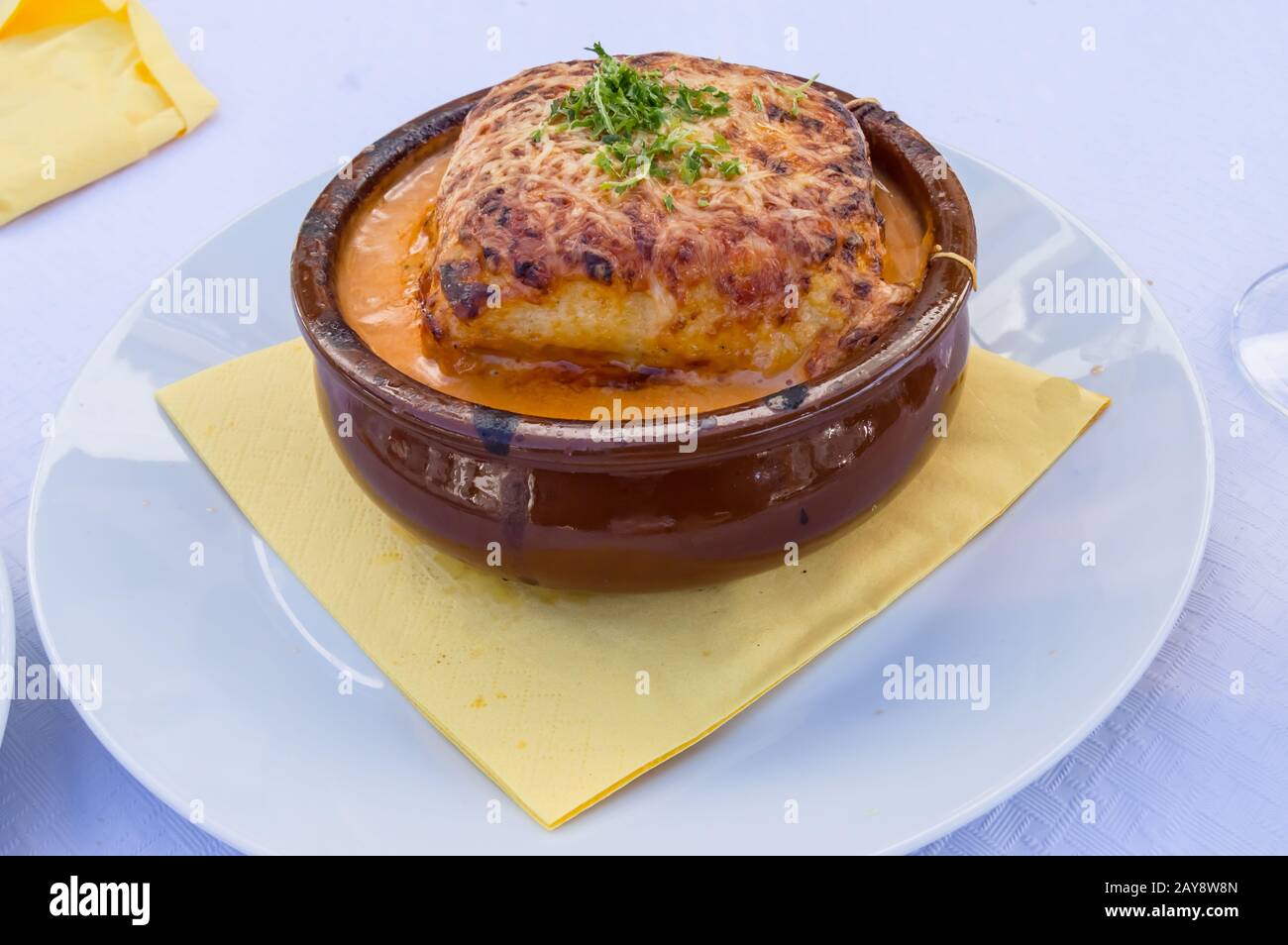 Portion of lasagna bolognese in a terracotta ramekin Stock Photo Alamy
