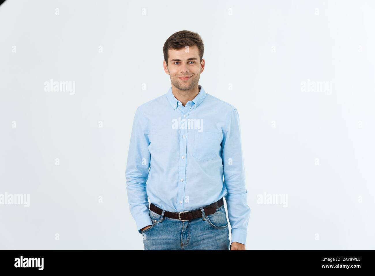 Portrait of happy fashionable handsome man in jeans and blue shirt look at  camera Stock Photo - Alamy
