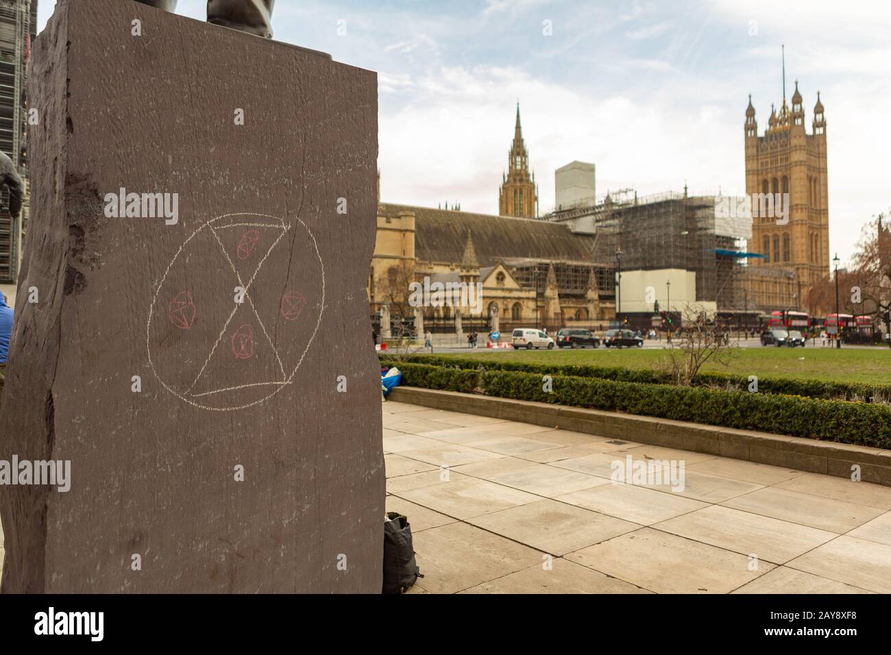 Chalk extinction symbol, on the side of the  Statue of David Lloyd George, Parliament Square, Westminster, London, UK Stock Photo