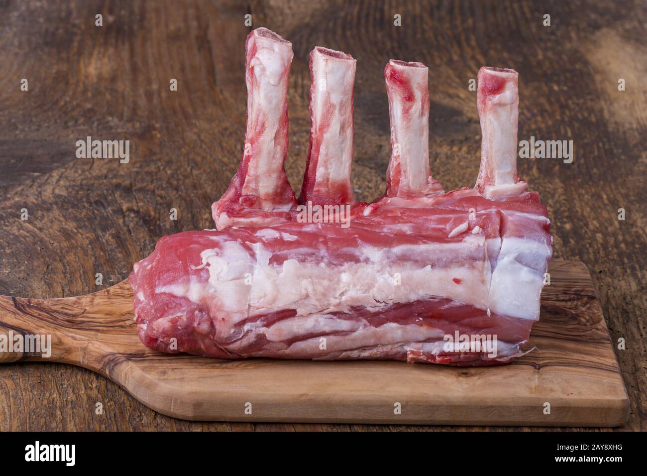 uncut raw veal loin on wood Stock Photo