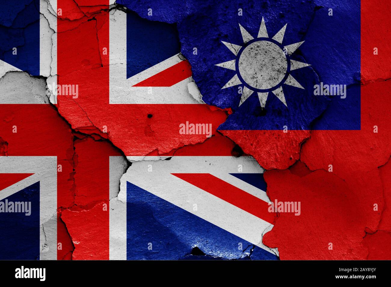 flags of UK and Taiwan painted on cracked wall Stock Photo