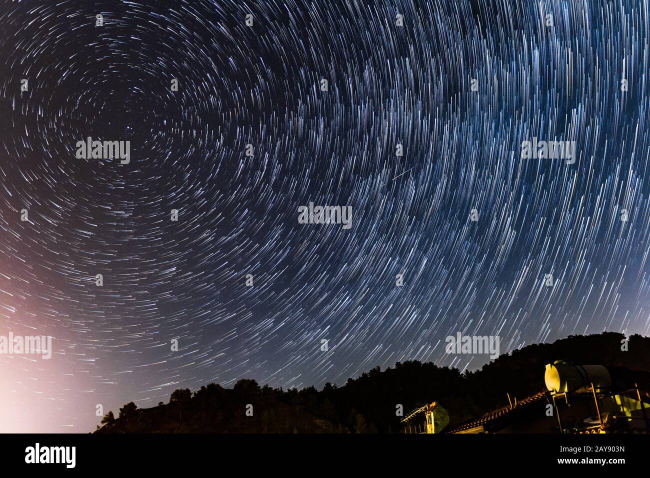 Star Trails round the polar star and over a house at the Troodos mountains Stock Photo