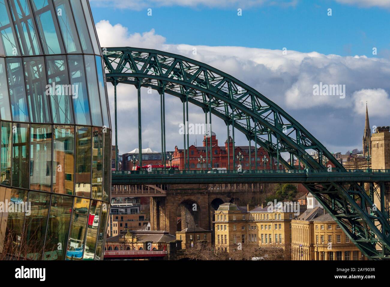 View of a section of the Sage Gateshead, Tyne Bridge and Newcastle Skyline. The Sage Gateshead is an international  home for mus Stock Photo