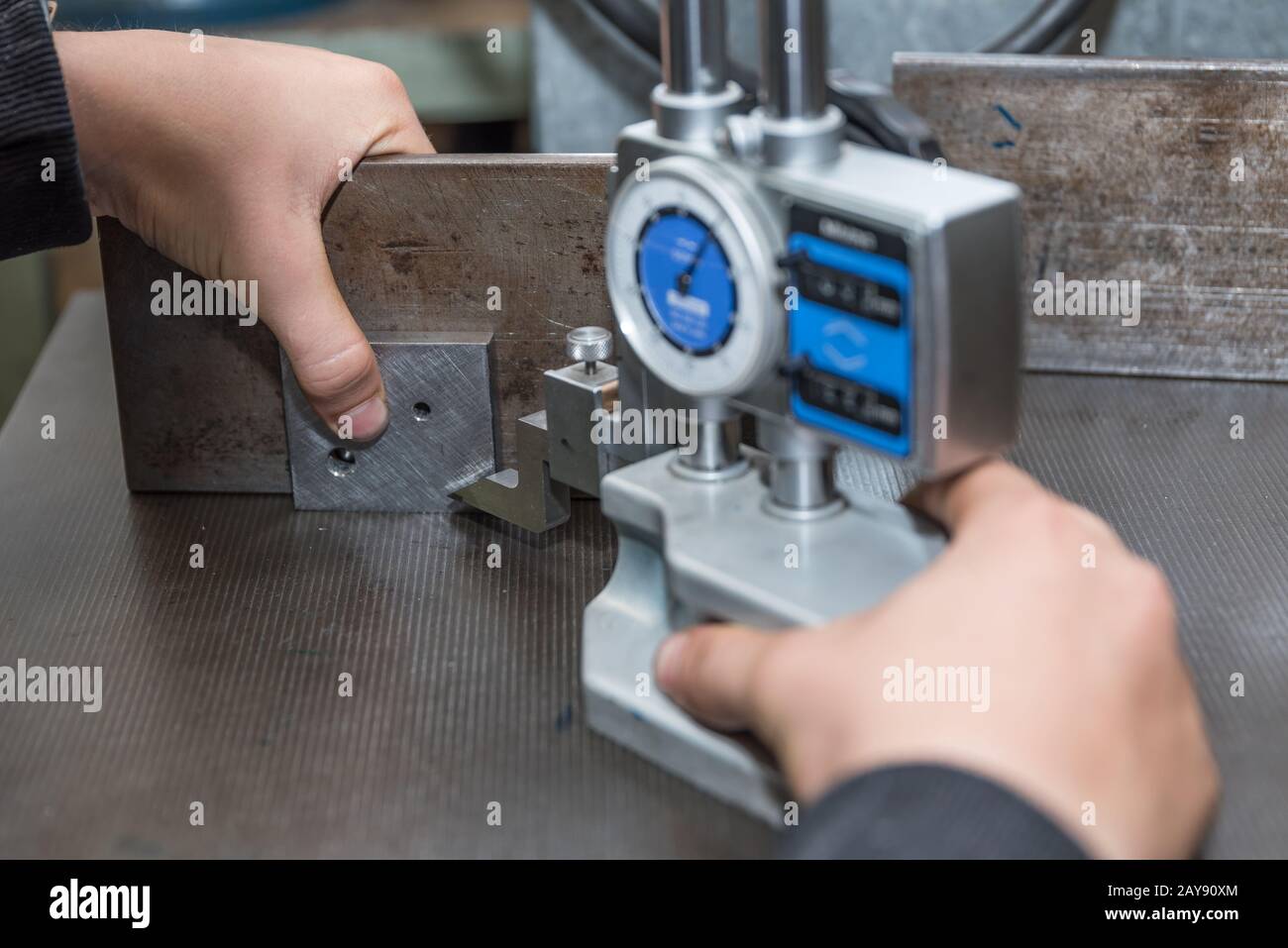 Metalworking with a height gauge - craftsmen Stock Photo