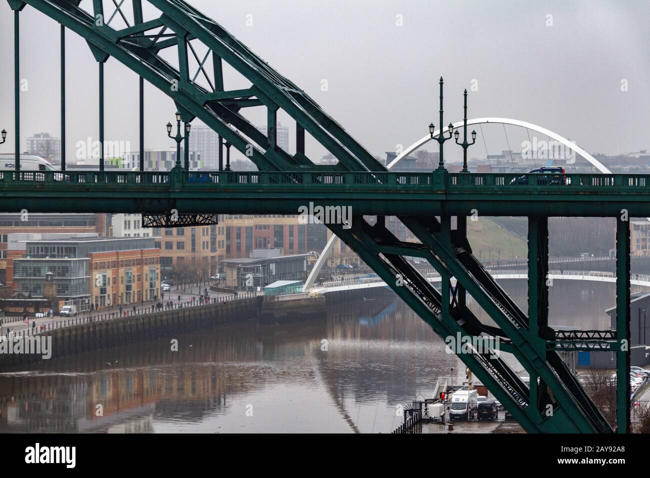Section of the Tyne Bridge in the foreground and Millenium Bridge in the distance at Newcastle Quayside Stock Photo