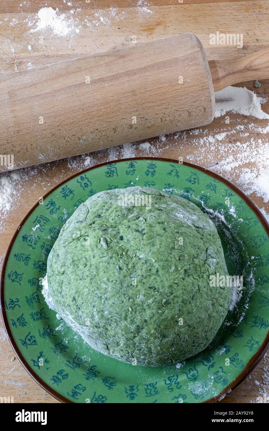 Dough for Chinese spinach noodles Stock Photo