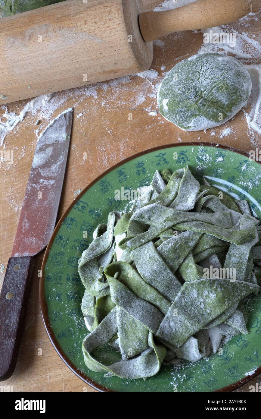 Chinese spinach noodles on a plate Stock Photo