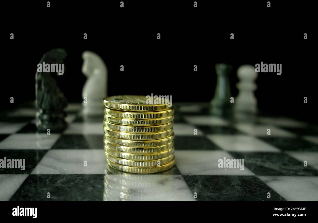 Gold coins on chess board Stock Photo Alamy