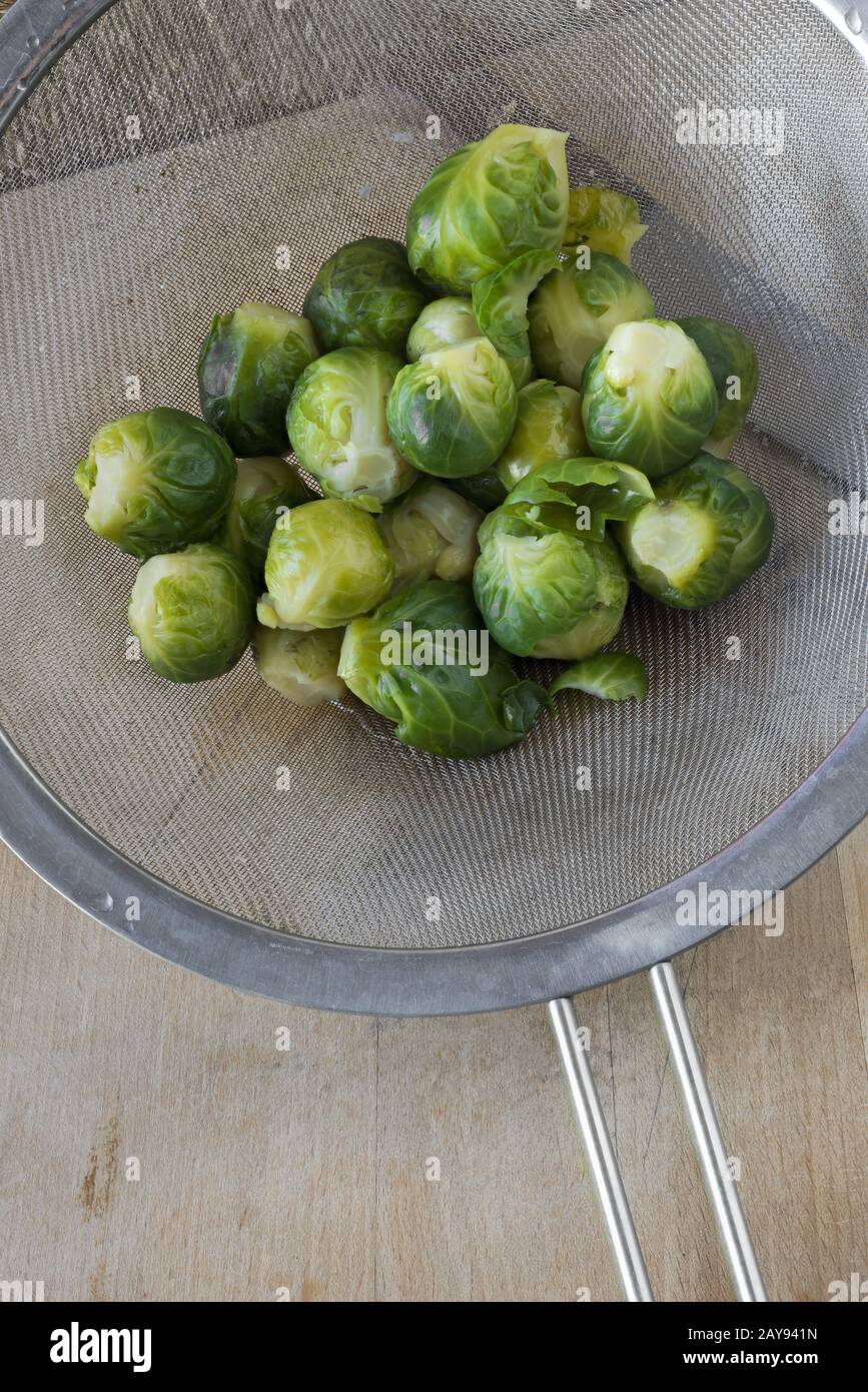Cooked Brussels sprouts in a sieve Stock Photo