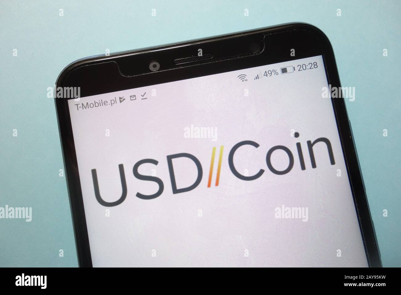 USD Coin (USDC) cryptocurrency logo displayed on smartphone Stock Photo