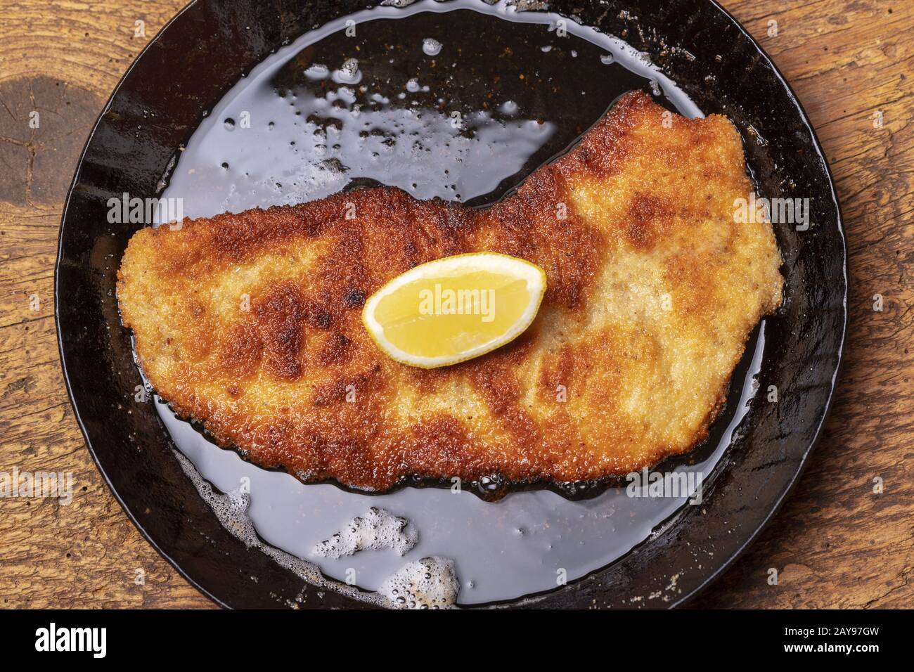 Wiener Schnitzel in a frying pan Stock Photo - Alamy