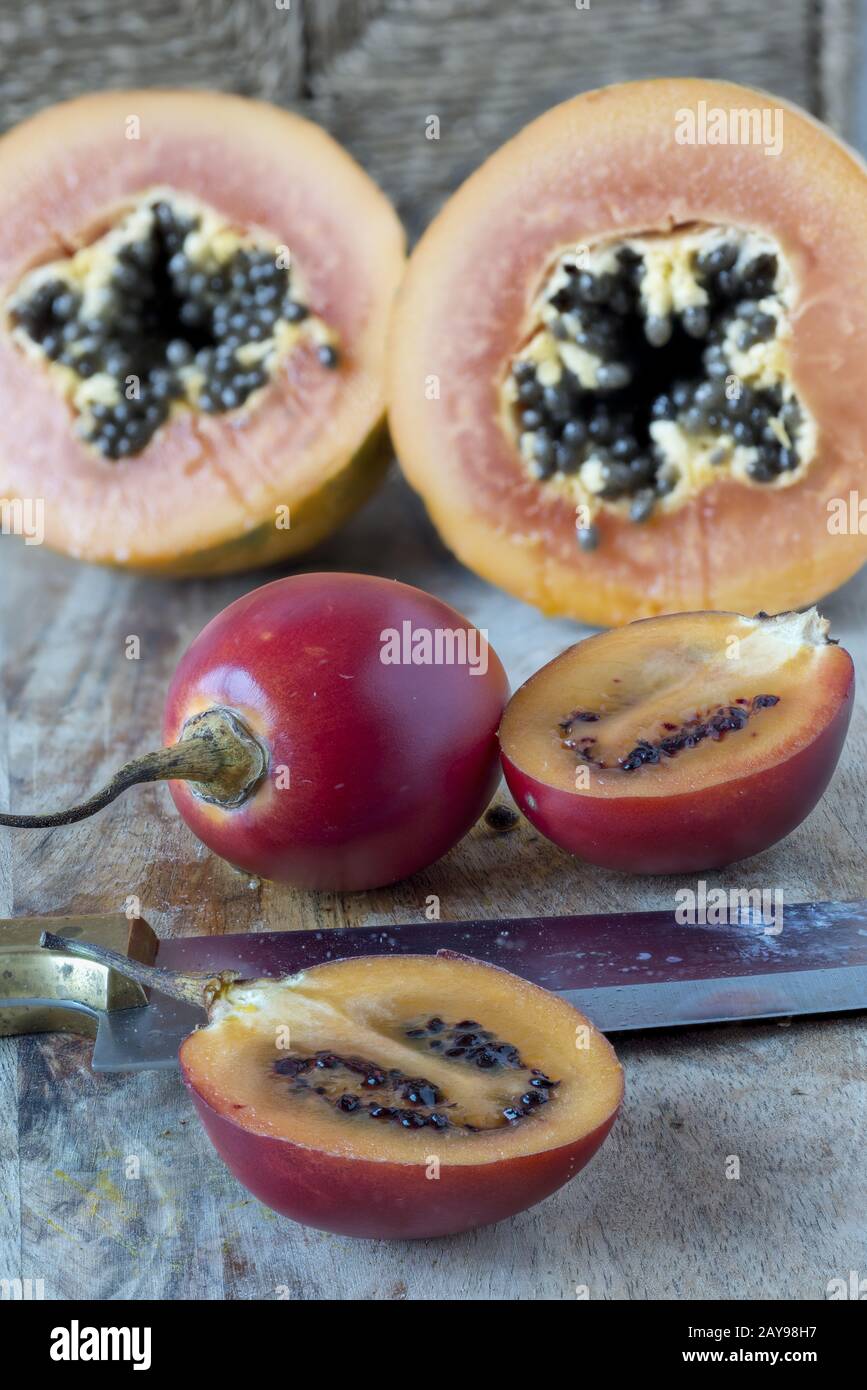 Tamarillos and papayas Stock Photo
