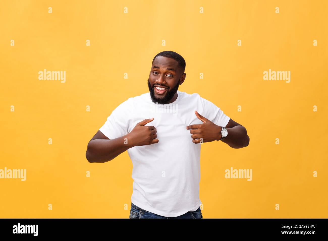 Young african american man over isolated background looking confident with smile on face, pointing oneself with fingers proud an Stock Photo