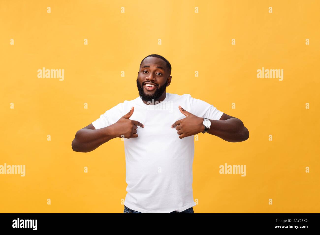Young african american man over isolated background looking confident with smile on face, pointing oneself with fingers proud an Stock Photo