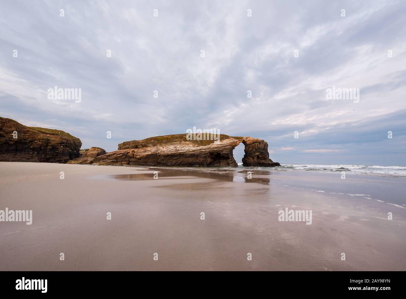 Natural rock arch in beach of Cathedrals in Lugo, Galicia, Spain Stock ...