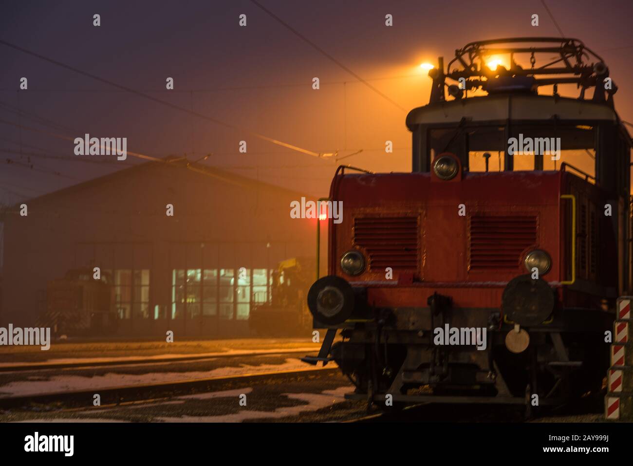 eerie mood at the station with freight train at night lighting Stock Photo