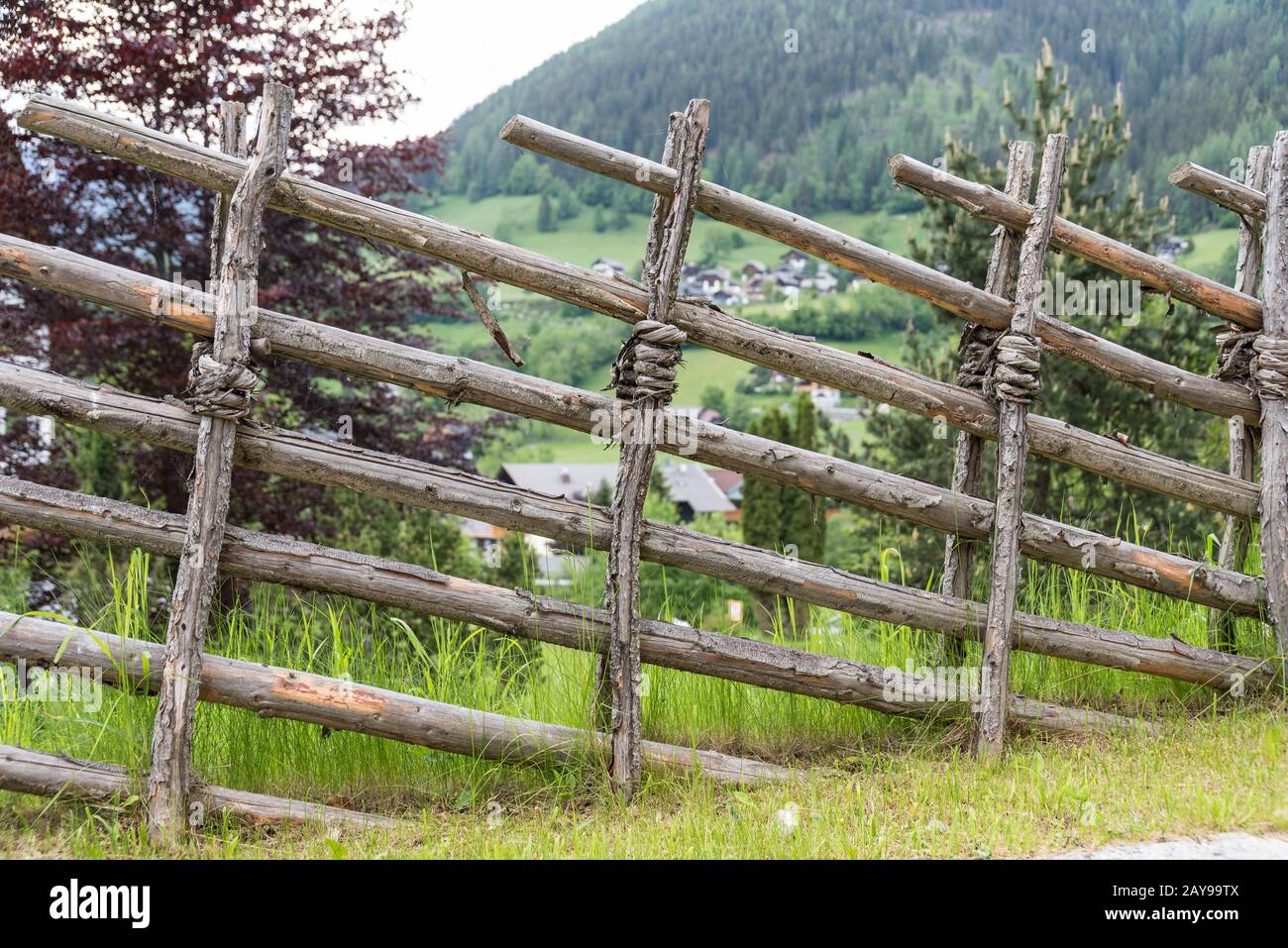 rustic fence as a border to the property in open countryside Stock Photo