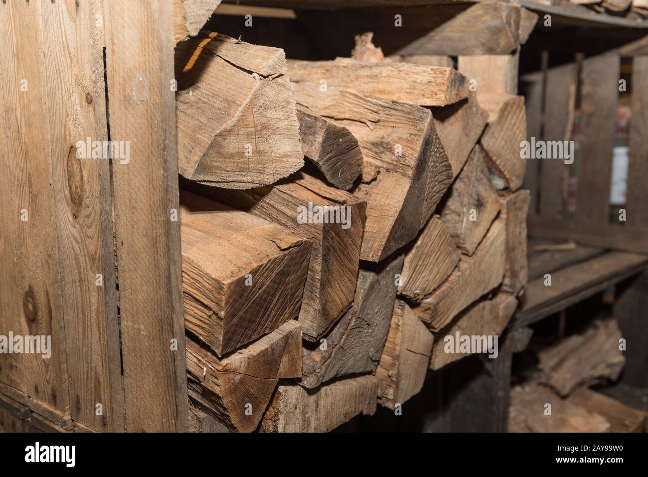 old wooden box for storage of oven-ready piece of wood - closeup of firewood Stock Photo