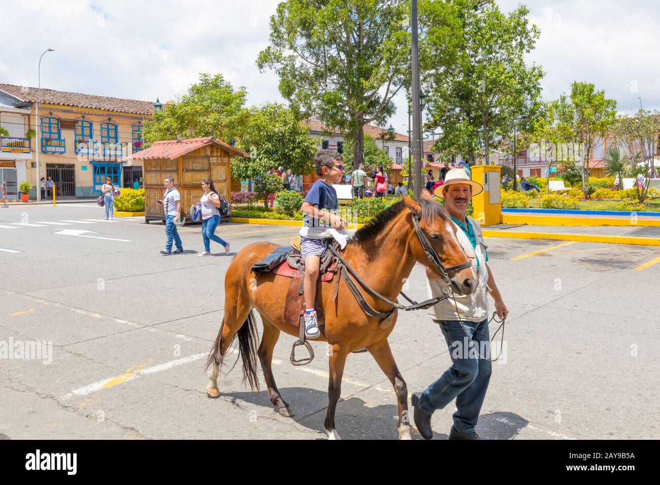 horseback ride in the Bolivar Square in the village of Filandia Colombia Stock Photo