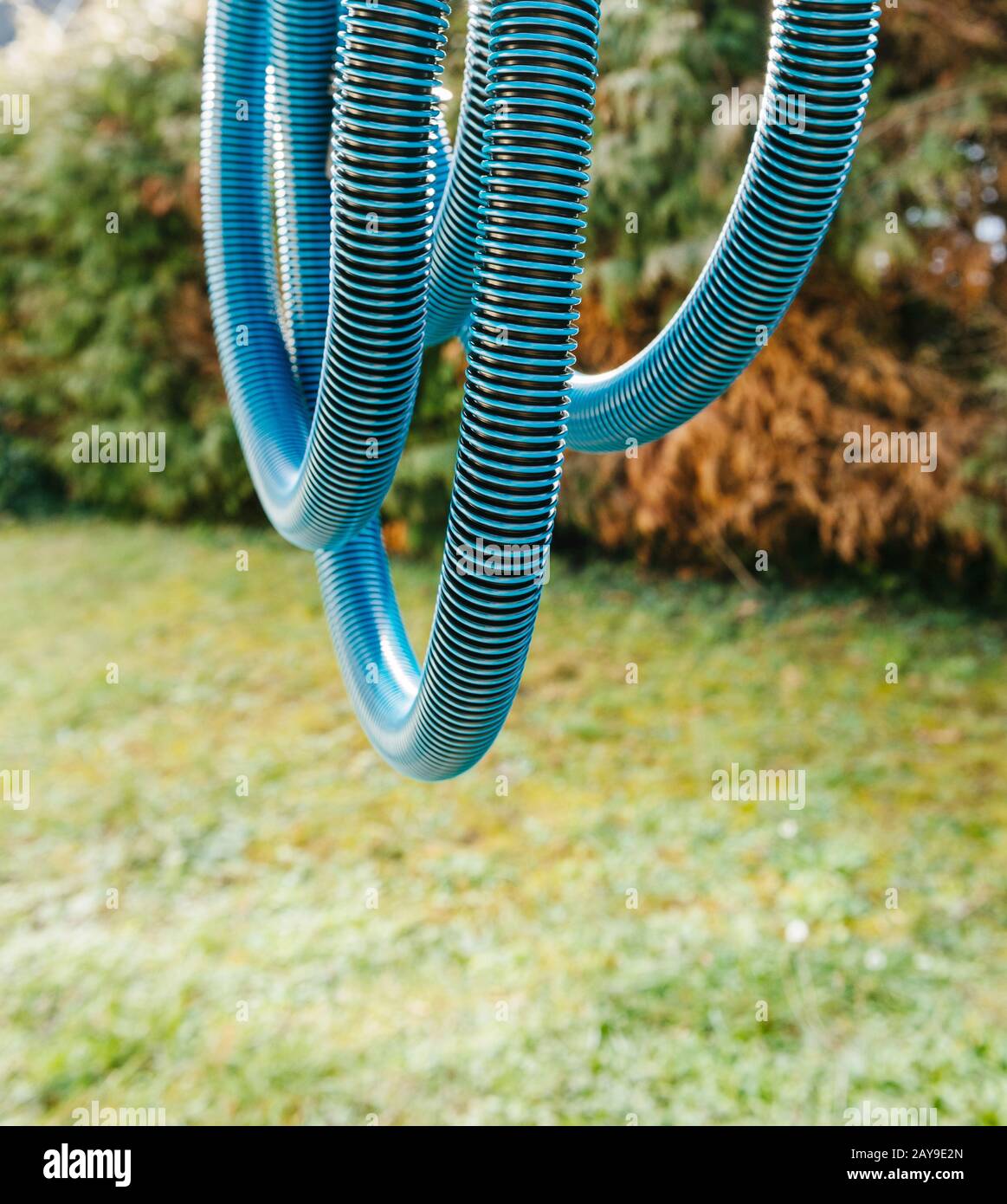 Detail of new blue anti static vacuum hose for a professional tool