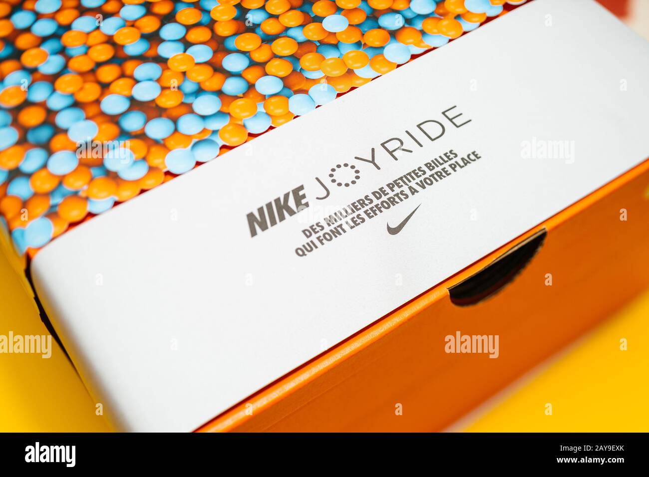 Paris, France - Jul 30, 2019: Close-up macro view of latest innovation from  Nike Sports the Joyride running shoes - package isolated on yellow  background Stock Photo - Alamy