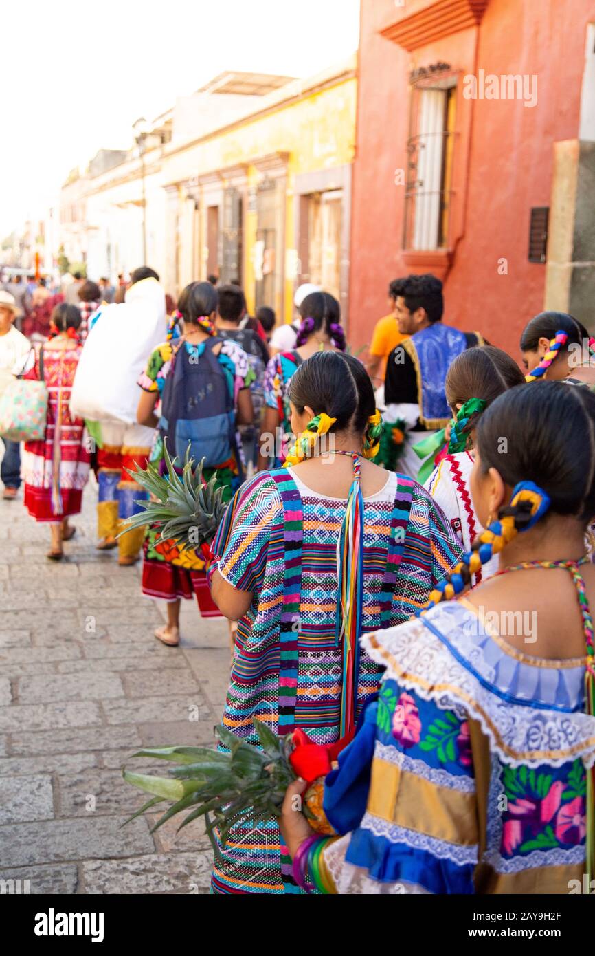 Mexican women, wearing traditional costumes, dancing on street Stock Photo