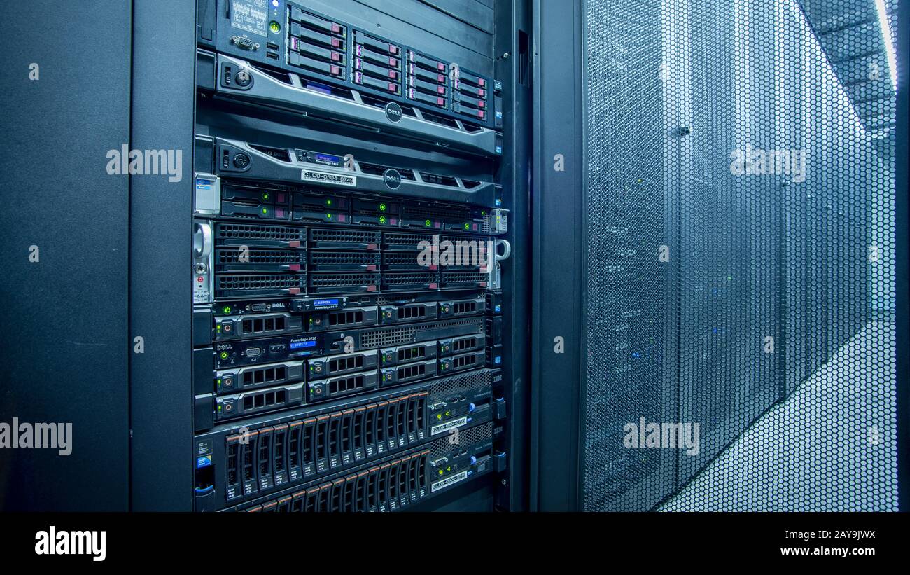 Server room full of racks and servers Stock Photo