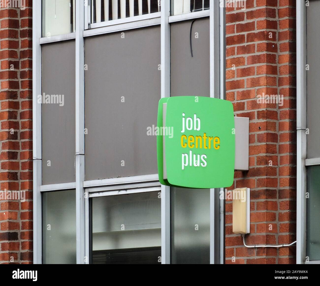 a sign outside a job centre plus in leeds england run by the UK