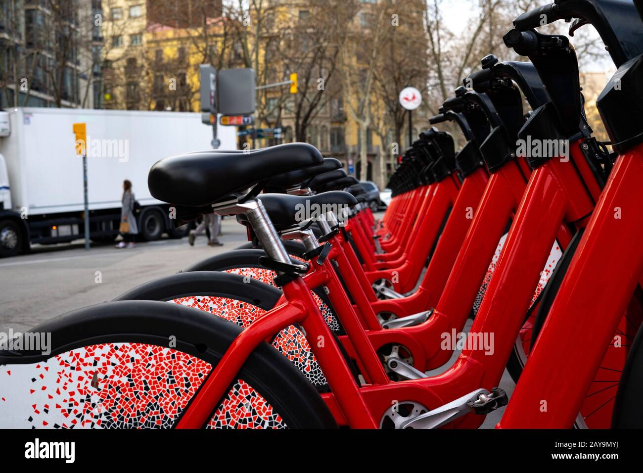 Red bikes in a bike rental station. Concept of bicycles and sustainable transport. Stock Photo