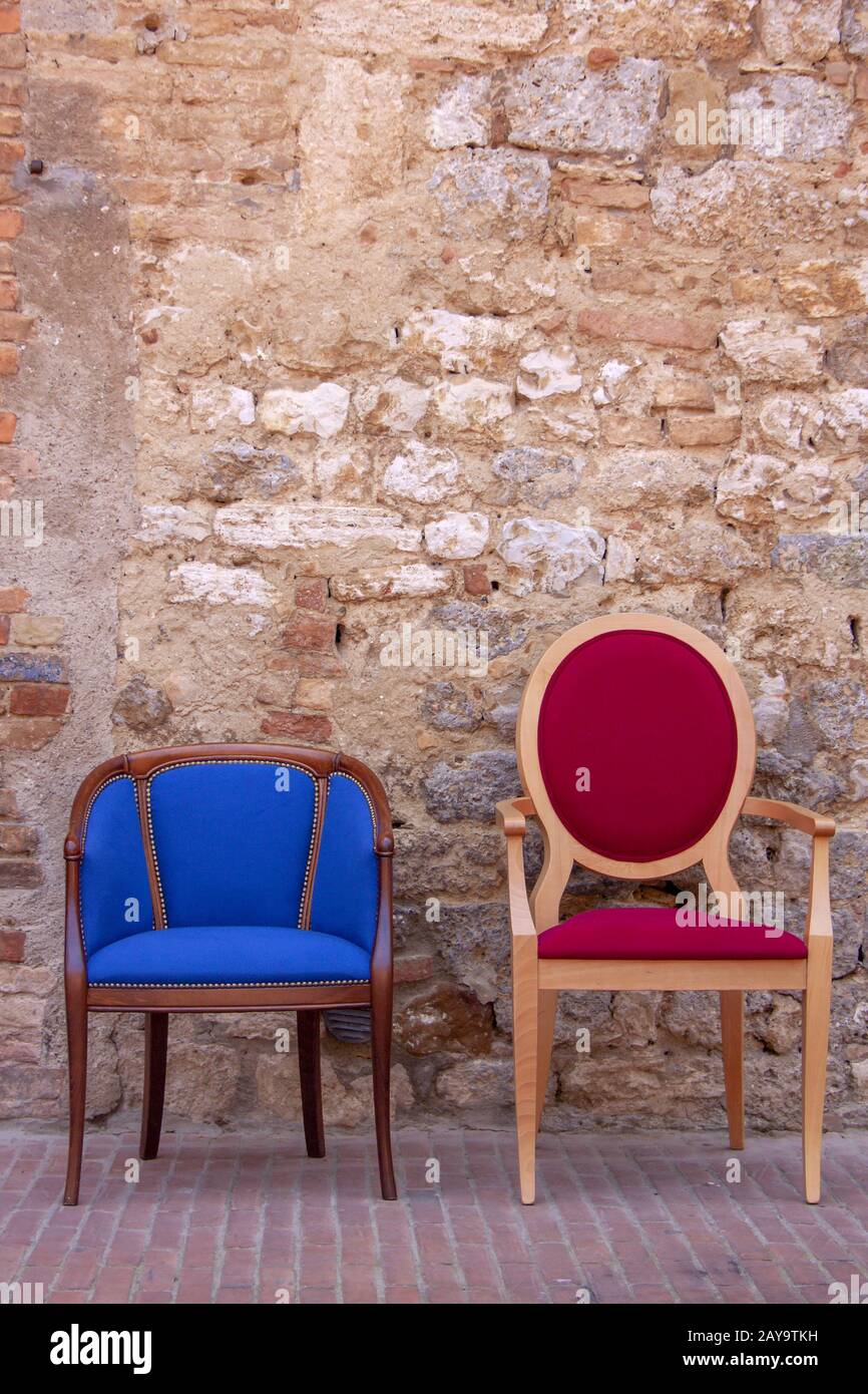 Two armchairs in front of the house wall Stock Photo
