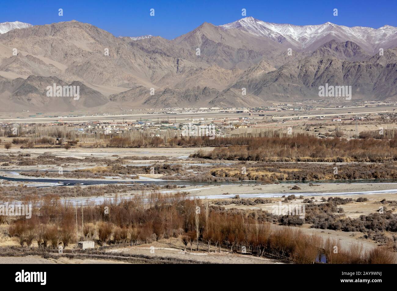 Looking north across the Indus River to Leh, Ladakh, India Stock Photo