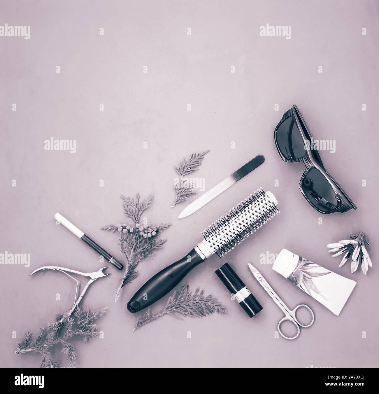 Cosmetics items on a light green background. Stock Photo