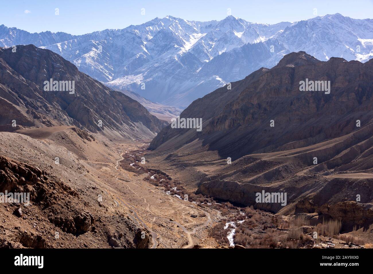 Ulley road, small stream and Ladakh Range, Ladakh, Jammu and Kashmir, India Stock Photo
