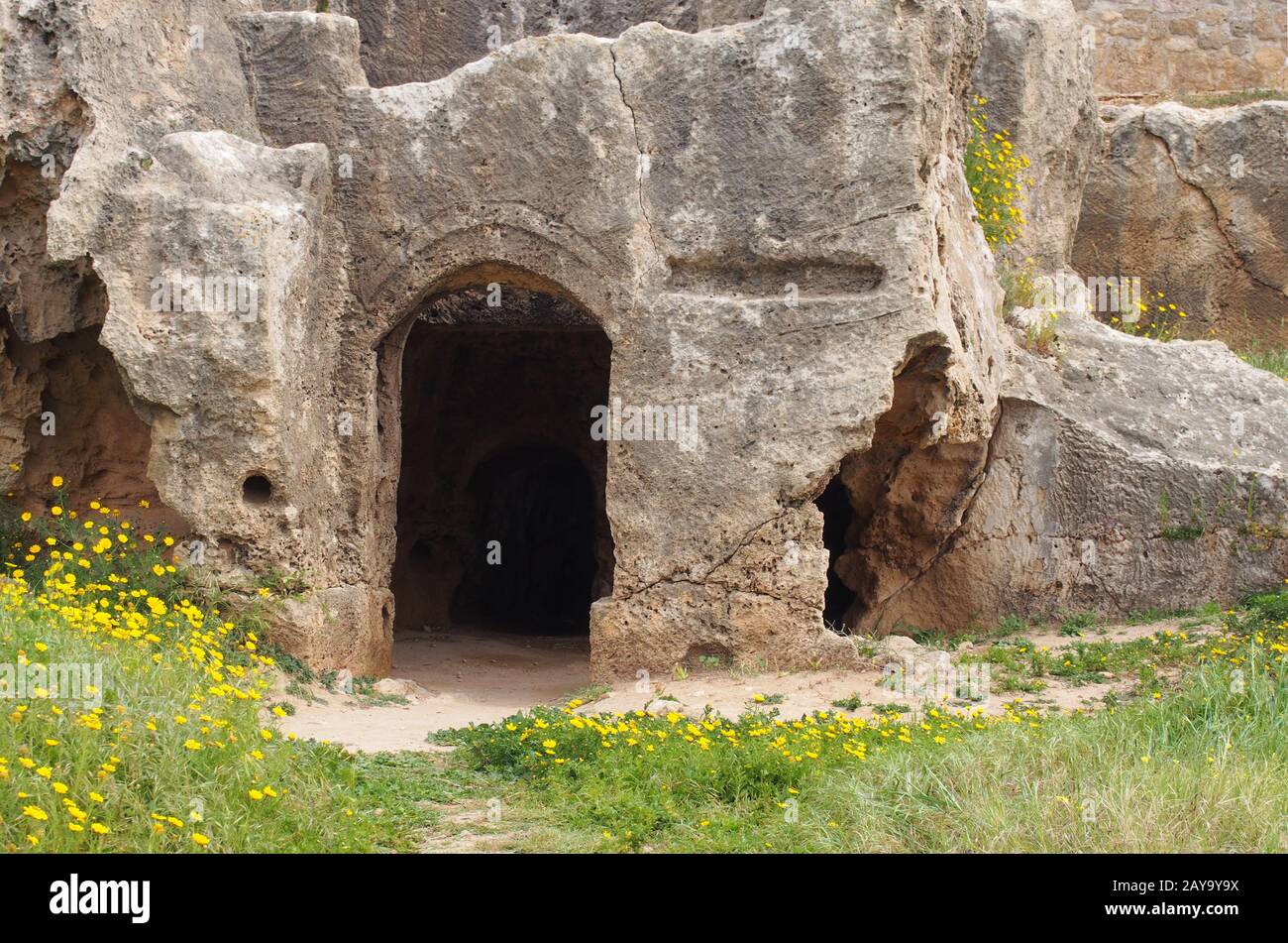 catacomb door carved into the rock face at the tomb of the kings in paphos cyprus Stock Photo