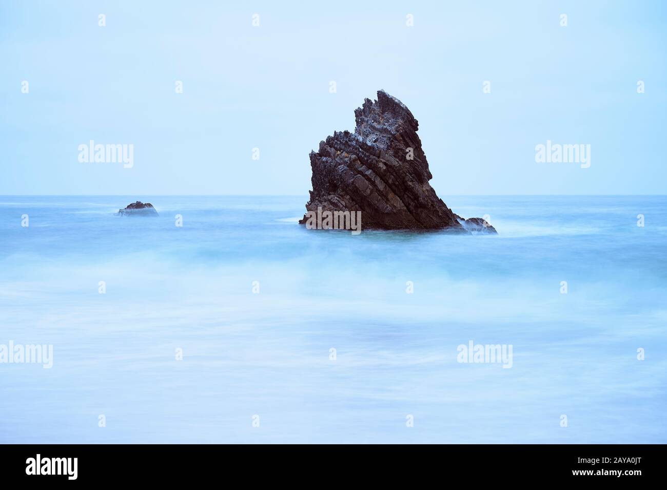 https://c8.alamy.com/comp/2AYA0JT/long-exposure-of-sharp-rock-on-the-sea-2AYA0JT.jpg