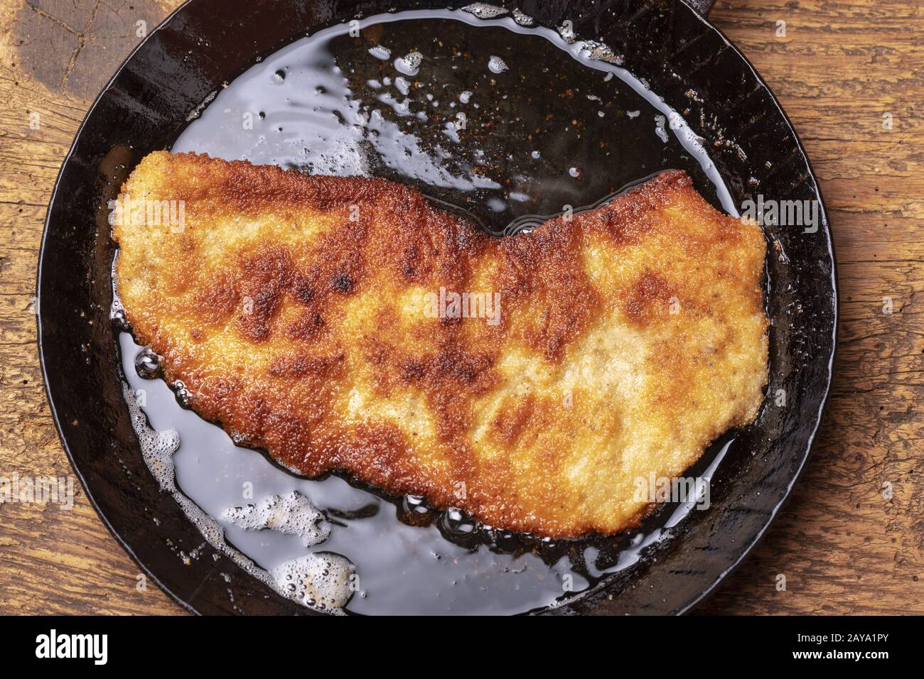 Wiener Schnitzel in a frying pan Stock Photo Alamy
