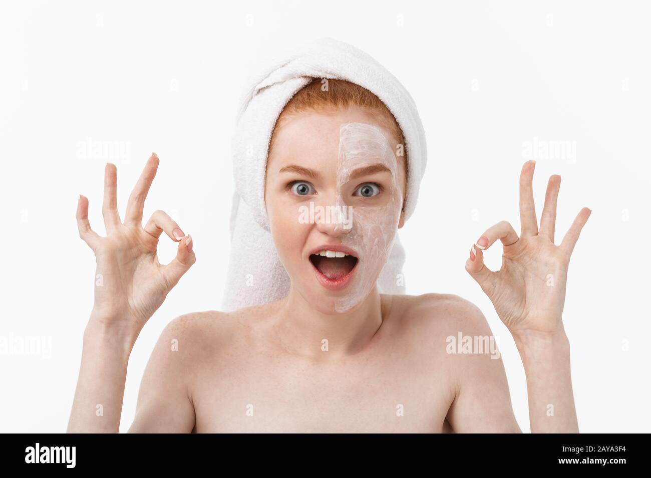 Beauty treatment. Woman applying moisturizing cream skin care product