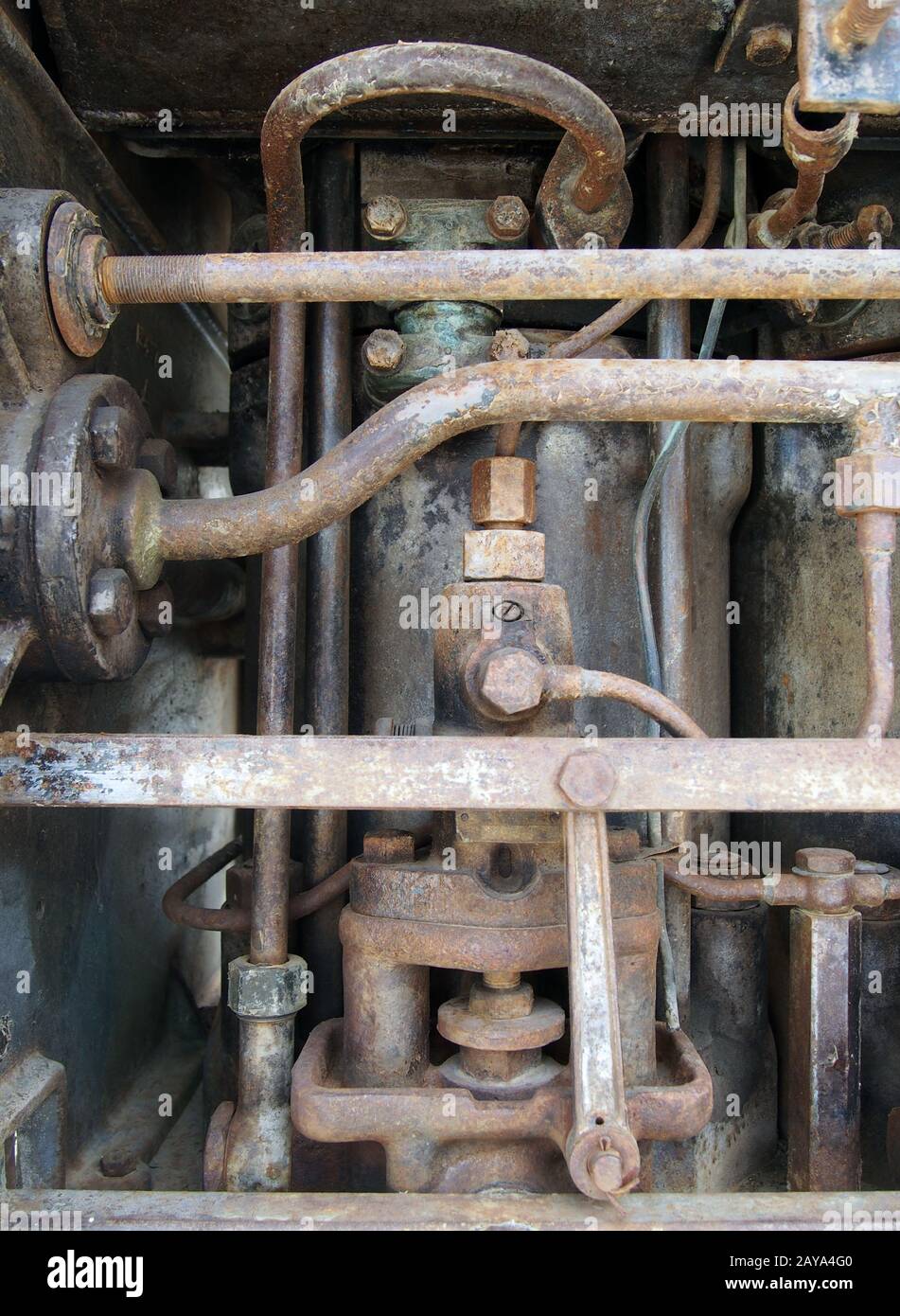 close up of a large old abandoned marine diesel engine showing rusting ...