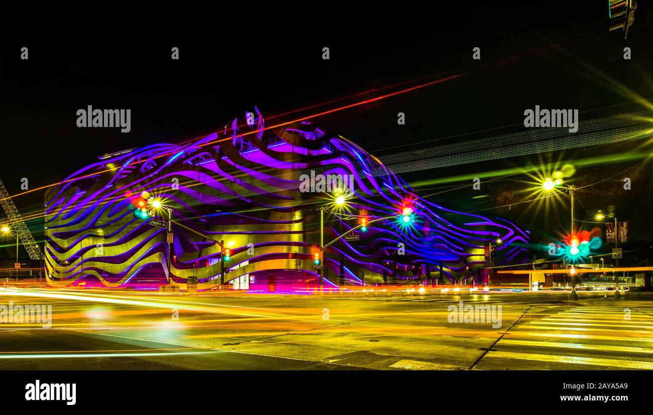 Exterior of Petersen Automotive Museum at night in november with car trails Stock Photo
