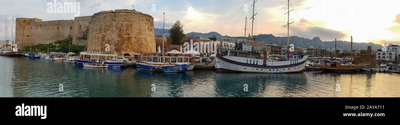 Panoramic capture of the historic 7th century AD Castle boats and old harbor in Kyrenia, Island of Cyprus Stock Photo