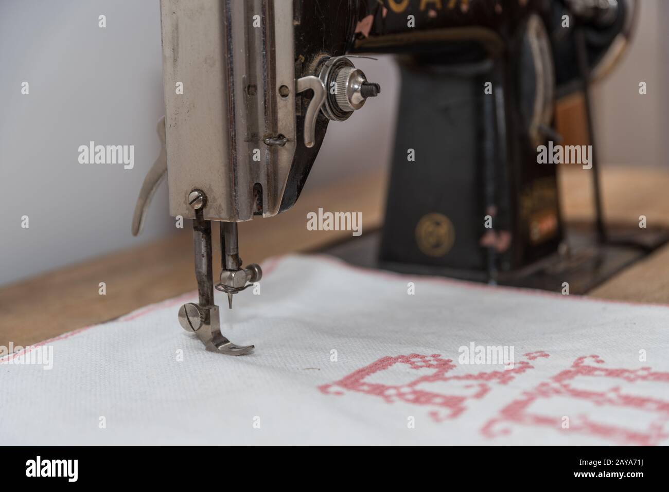 old antique sewing machine is used to embroider - close-up Stock Photo