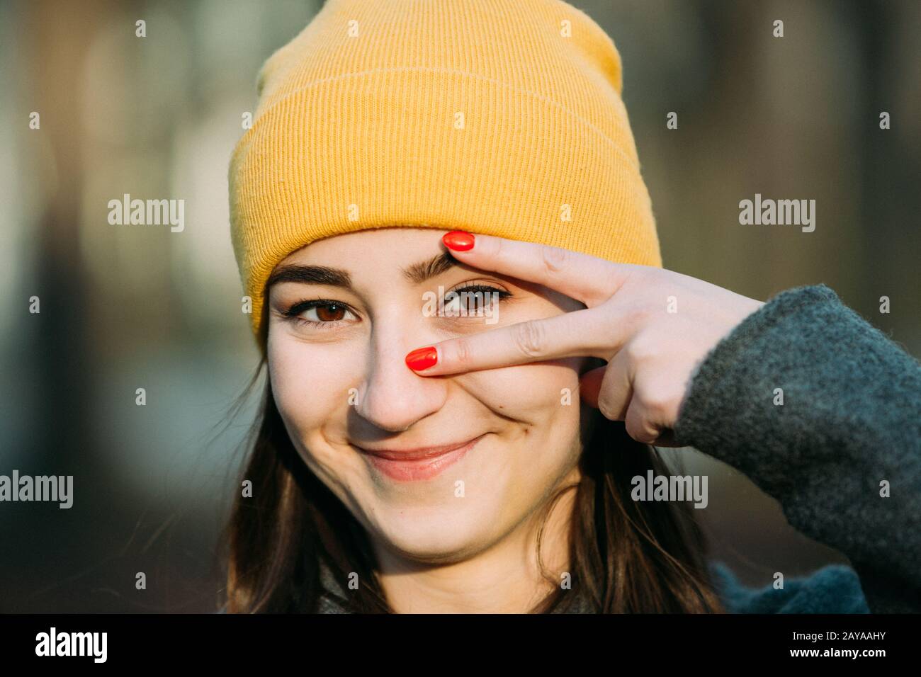 Young woman gesturing with her fingers eye focus. Stock Photo