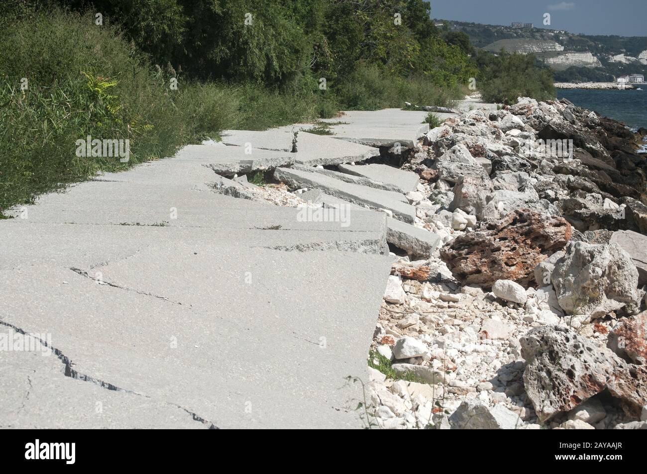 Destroyed by sea water erosion process seaside promenade concrete cover Stock Photo