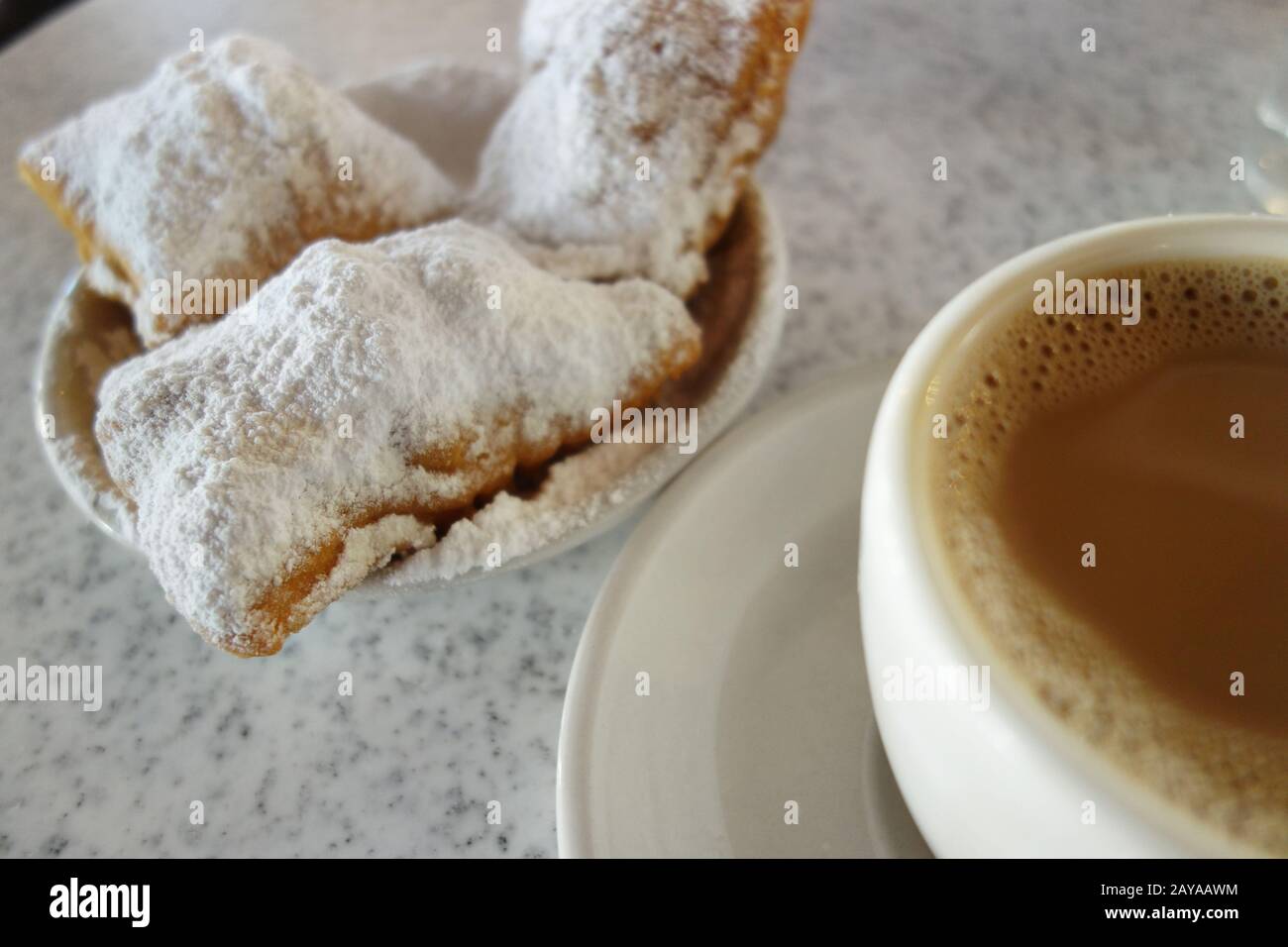 Beignets and chicory coffee in New Orleans Stock Photo