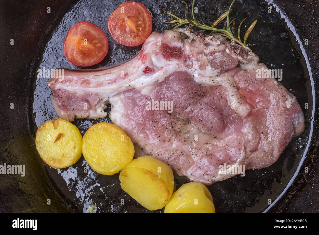 Veal escalope in an iron pan Stock Photo Alamy
